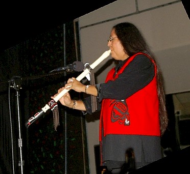 Mary playing her Raven Flute